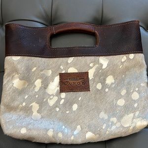 Canoe calf hair clutch